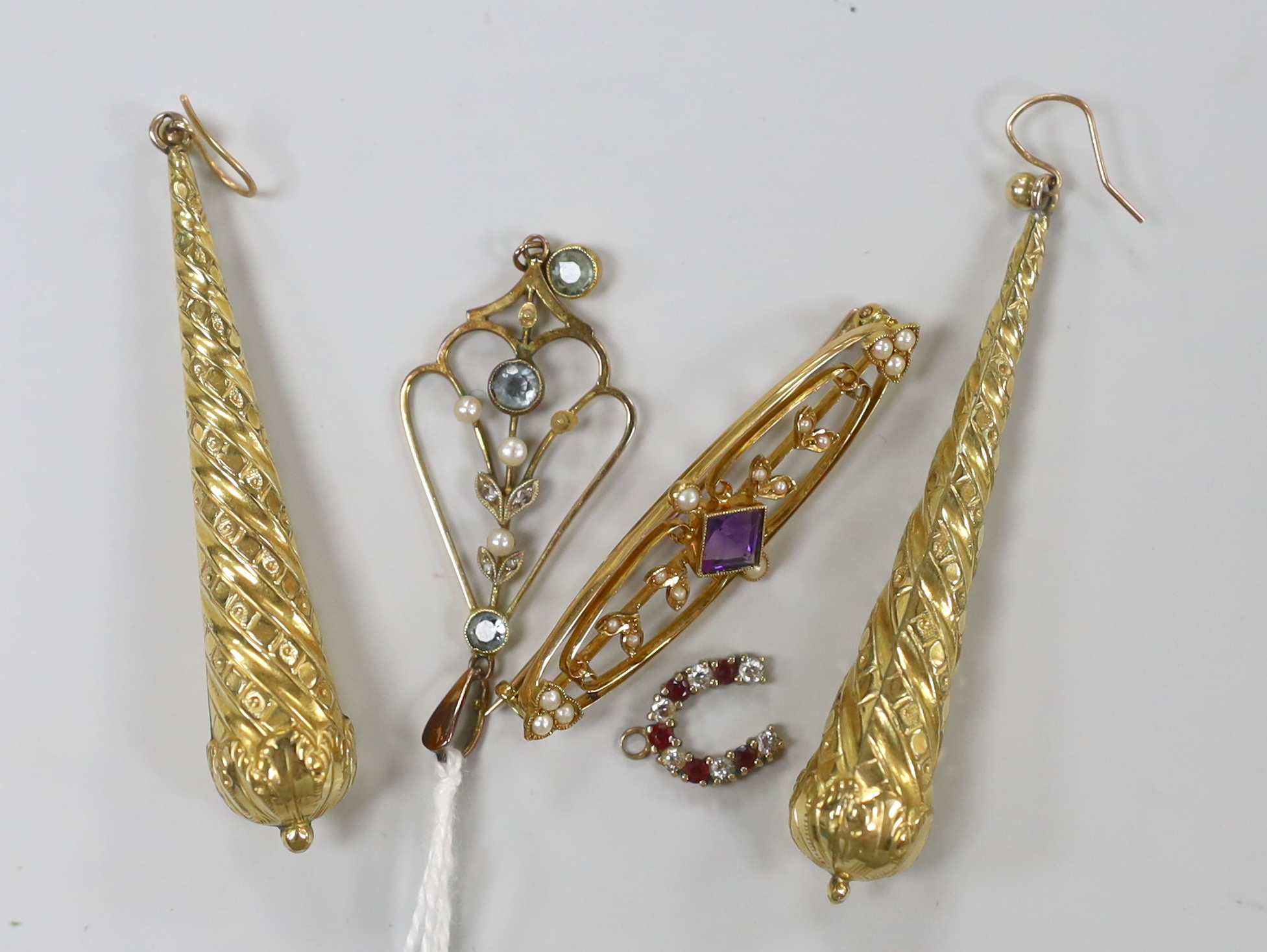 An Edwardian 15ct, aquamarine, diamond chip and seed pearl set drop pendant, 49mm and a similar amethyst and seed pearl set bar brooch, gross 6.3 grams, together with a gem set horseshoe charm and a pair of gold plated d